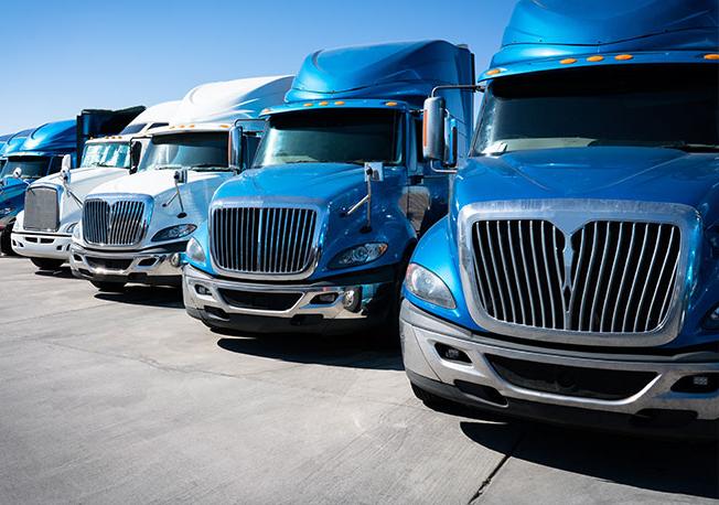 Row of blue semi-trucks.